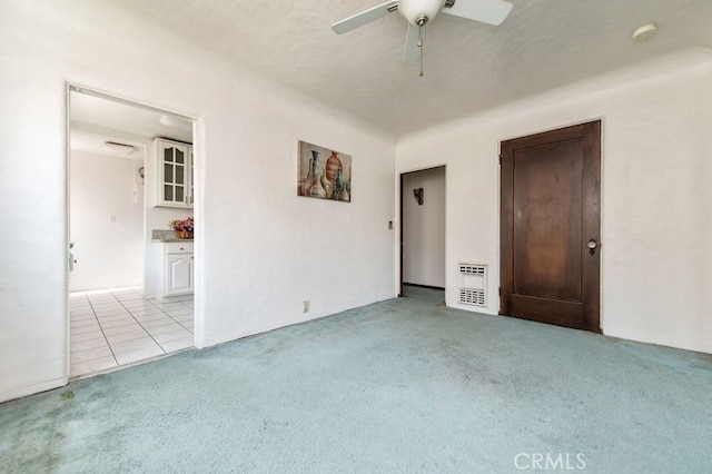 329 N Bushnell Ave, Alhambra, CA 91801 - empty room with light carpet, ceiling fan, a smoke detector, and light tile patterned floors