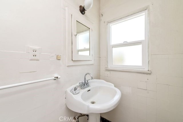 329 N Bushnell Ave, Alhambra, CA 91801 - bathroom featuring tile walls and healthy amount of natural light