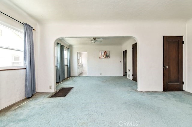 329 N Bushnell Ave, Alhambra, CA 91801 - carpeted empty room featuring arched walkways and a ceiling fan