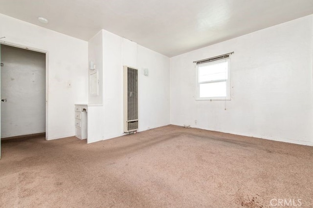 329 N Bushnell Ave, Alhambra, CA 91801 - unfurnished room with a heating unit, carpet flooring, and a smoke detector