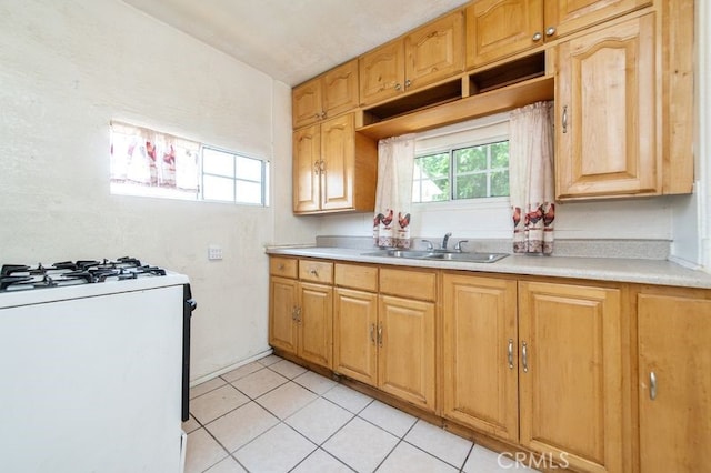 329 N Bushnell Ave, Alhambra, CA 91801 - kitchen featuring white gas range, light countertops, and light tile patterned floors