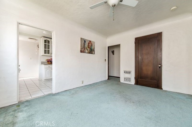 329 N Bushnell Ave, Alhambra, CA 91801 - empty room featuring light colored carpet, ceiling fan, a smoke detector, and light tile patterned floors