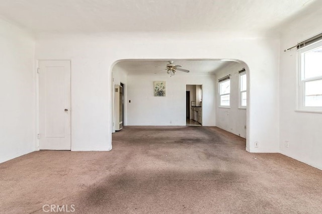 329 N Bushnell Ave, Alhambra, CA 91801 - unfurnished living room with arched walkways, carpet floors, and ceiling fan