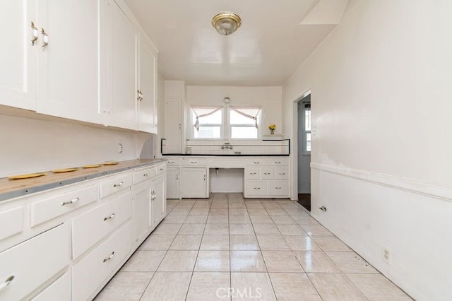329 N Bushnell Ave, Alhambra, CA 91801 - kitchen with white cabinetry and light tile patterned flooring