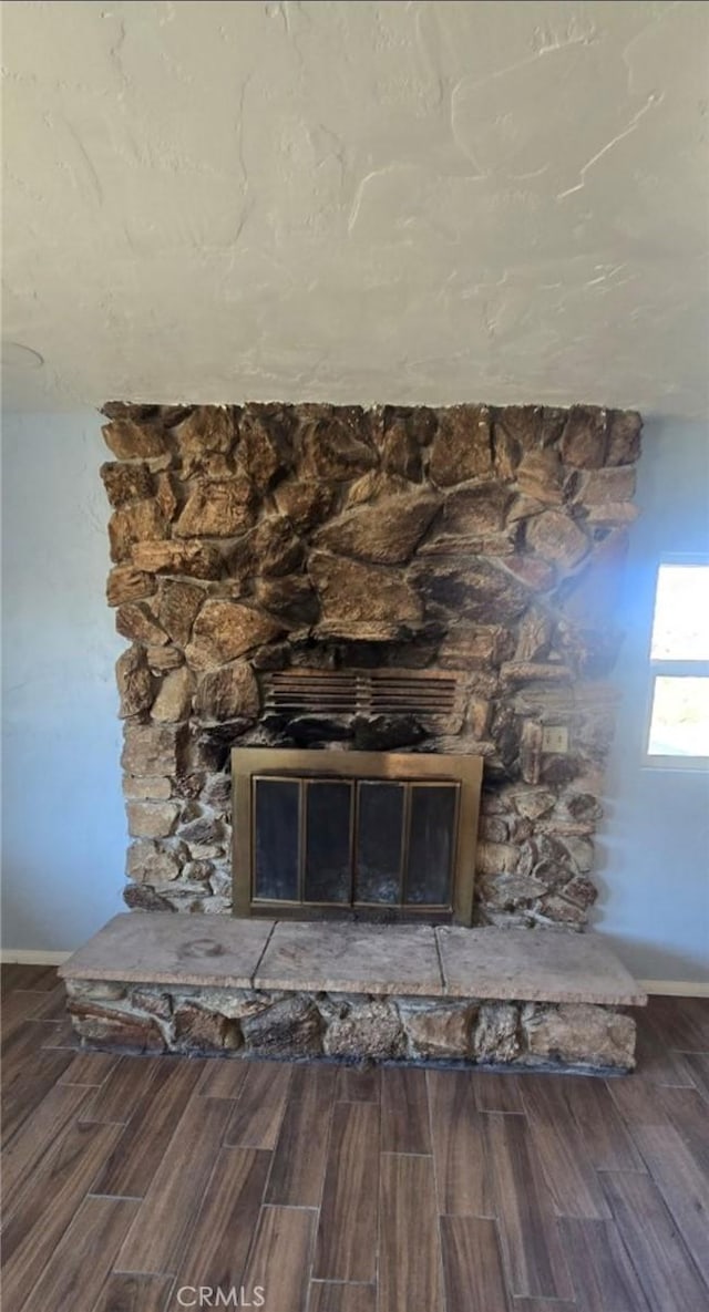 7744 Victor, Yucca Valley, CA 92284 - detailed view of wood finished floors and a stone fireplace