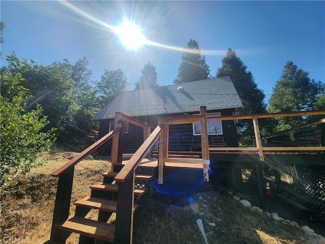 29746 Redwood Rd, Cedar Glen, CA 92321 - back of property featuring a shingled roof and stairway