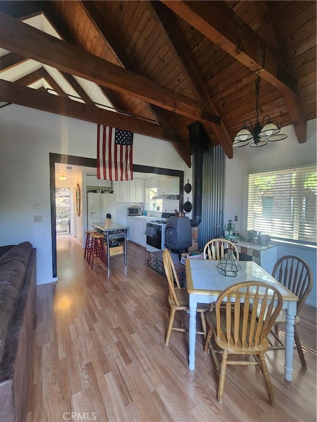 29746 Redwood Rd, Cedar Glen, CA 92321 - dining space featuring wood finished floors, a chandelier, high vaulted ceiling, and a wooden ceiling with exposed beams