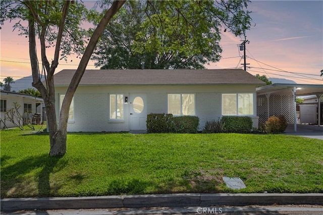3024 Carl St, Riverside, CA 92507 - ranch-style home with a lawn, an attached carport, and brick siding