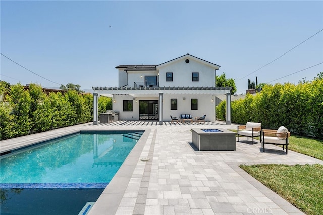 251 S Griffith Park Dr, Burbank, CA 91506 - back of house with a pergola, an outdoor fire pit, a patio, stucco siding, and a pool with connected hot tub