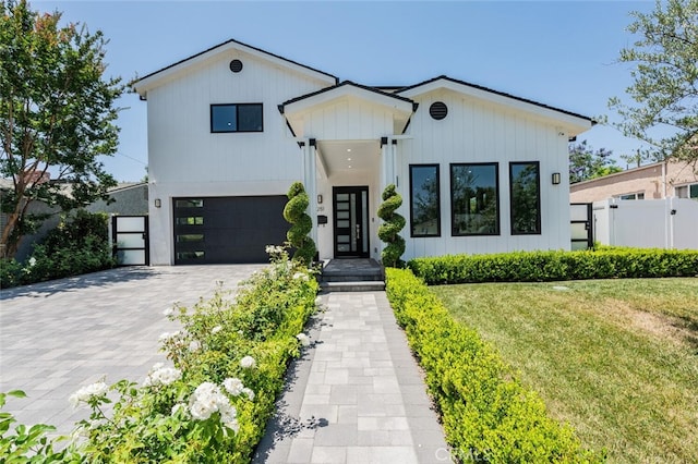251 S Griffith Park Dr, Burbank, CA 91506 - view of front of property featuring an attached garage, decorative driveway, and board and batten siding