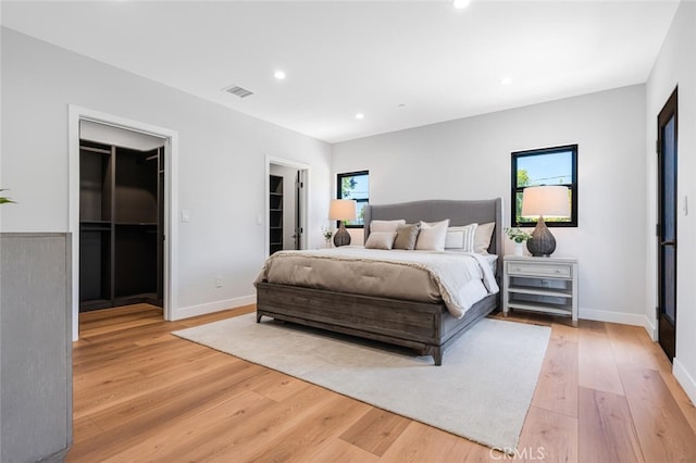 251 S Griffith Park Dr, Burbank, CA 91506 - bedroom featuring a spacious closet, light wood-style floors, multiple windows, recessed lighting, and a closet