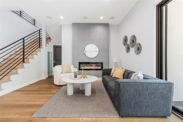 251 S Griffith Park Dr, Burbank, CA 91506 - living room with wood finished floors, stairs, a large fireplace, and recessed lighting