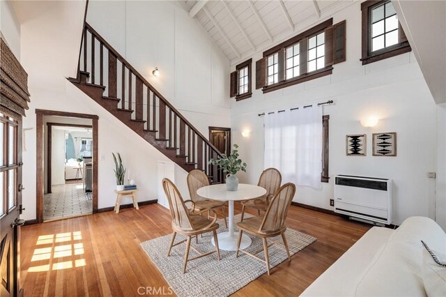 525 Manhattan Beach Blvd, Manhattan Beach, CA 90266 - dining area with high vaulted ceiling, hardwood / wood-style flooring, stairway, heating unit, and beamed ceiling