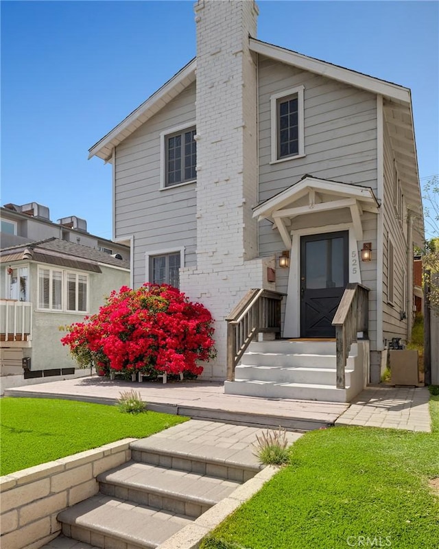 525 Manhattan Beach Blvd, Manhattan Beach, CA 90266 - view of front of house with a chimney and a front lawn