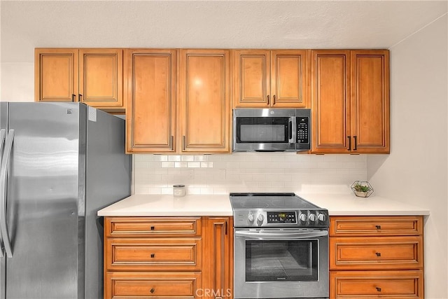 3096 Panorama Rd Unit A, Riverside, CA 92506 - kitchen with stainless steel appliances, light countertops, brown cabinets, and decorative backsplash