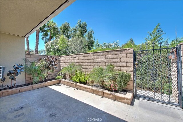 3096 Panorama Rd Unit A, Riverside, CA 92506 - view of patio featuring a gate