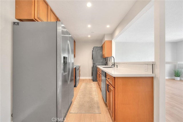 3096 Panorama Rd Unit A, Riverside, CA 92506 - kitchen featuring appliances with stainless steel finishes, light wood-type flooring, recessed lighting, light countertops, and brown cabinetry