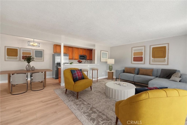 3096 Panorama Rd Unit A, Riverside, CA 92506 - living room with a textured ceiling and light wood finished floors