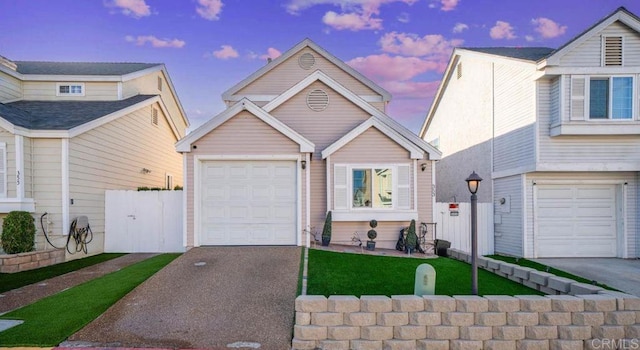 353 61st St, San Diego, CA 92114 - view of front facade with a garage and asphalt driveway