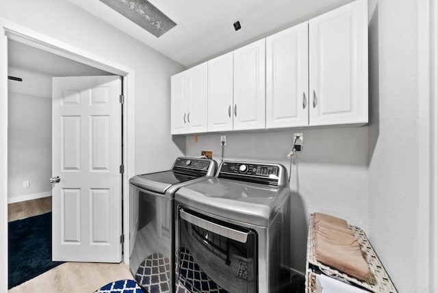 353 61st St, San Diego, CA 92114 - laundry room with cabinet space, light wood-style floors, and washing machine and dryer