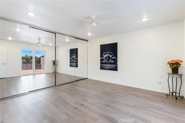 3066 Via Serena S Unit A, Laguna Woods, CA 92637 - unfurnished bedroom featuring access to exterior, wood finished floors, recessed lighting, and ceiling fan