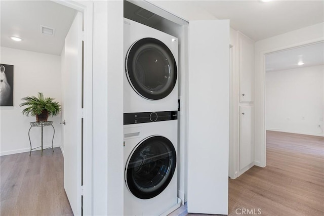 3066 Via Serena S Unit A, Laguna Woods, CA 92637 - laundry room featuring estacked washer and dryer and light wood-style floors