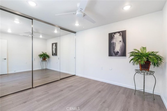3066 Via Serena S Unit A, Laguna Woods, CA 92637 - unfurnished bedroom with wood finished floors, a closet, recessed lighting, and a ceiling fan