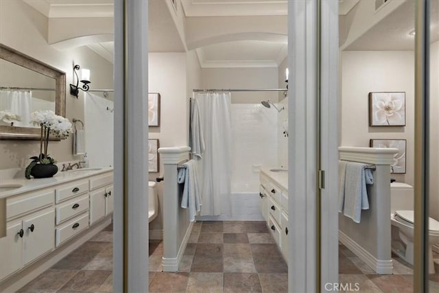 17202 Corbina Ln Unit 208, Huntington Beach, CA 92649 - bathroom featuring double vanity, crown molding, and shower / tub combo