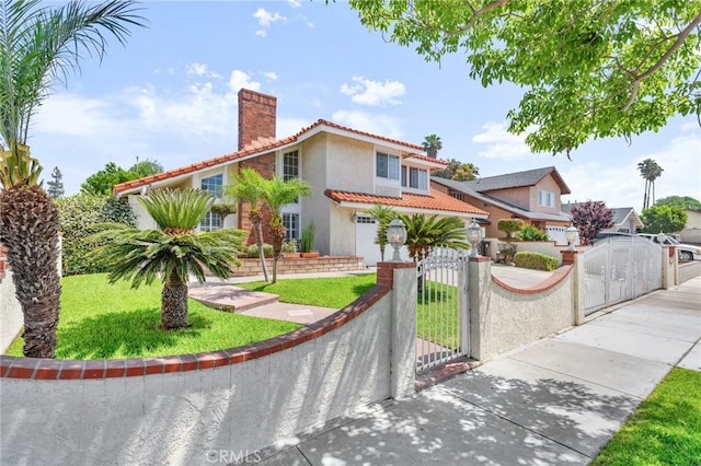 1465 E Tam O Shanter St, Ontario, CA 91761 - mediterranean / spanish-style home with a gate, a chimney, a tiled roof, stucco siding, and a fenced front yard