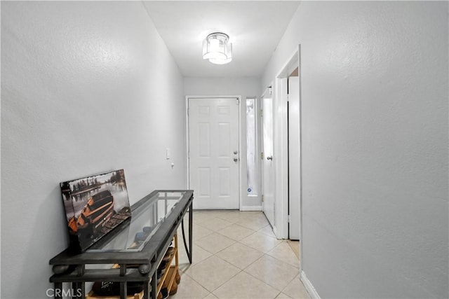 1465 E Lexington Ave Unit 4C, El Cajon, CA 92019 - entryway with light tile patterned floors and baseboards