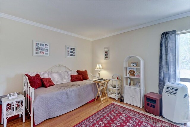 2205 Via Mariposa E Unit A, Laguna Woods, CA 92637 - bedroom with crown molding and wood finished floors