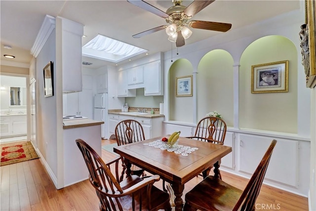2205 Via Mariposa E Unit A, Laguna Woods, CA 92637 - dining area with ceiling fan, light wood-type flooring, recessed lighting, and ornamental molding