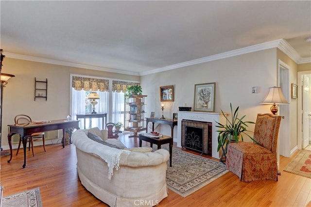 2205 Via Mariposa E Unit A, Laguna Woods, CA 92637 - living room featuring light wood-style floors, crown molding, and a fireplace