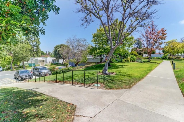 2205 Via Mariposa E Unit A, Laguna Woods, CA 92637 - surrounding community featuring concrete driveway and a residential view
