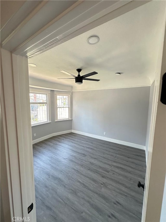 696 E 51st St E, Los Angeles, CA 90011 - empty room with ceiling fan, dark wood-style floors, and a textured ceiling