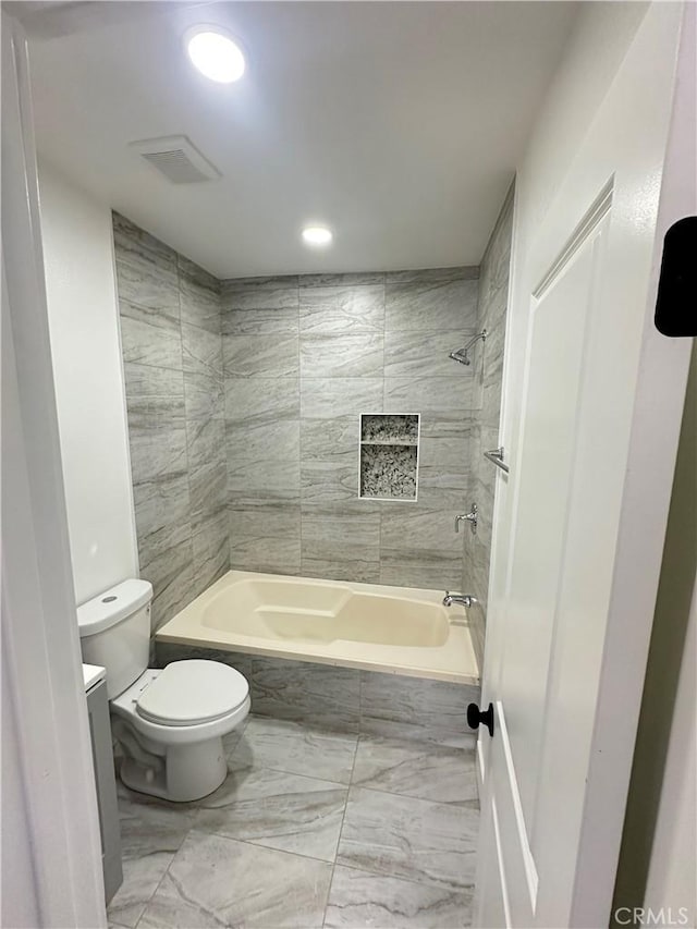 696 E 51st St E, Los Angeles, CA 90011 - full bathroom featuring marble look tiles, washtub / shower combination, and recessed lighting
