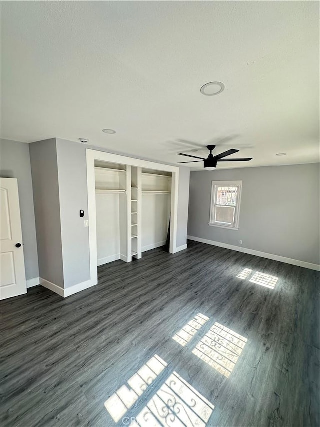 696 E 51st St E, Los Angeles, CA 90011 - unfurnished bedroom featuring dark wood-style floors, a closet, and ceiling fan
