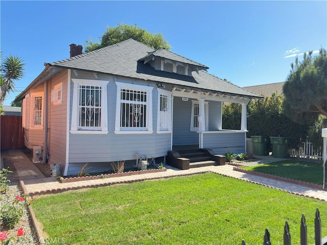 696 E 51st St E, Los Angeles, CA 90011 - bungalow-style house with a chimney and a porch