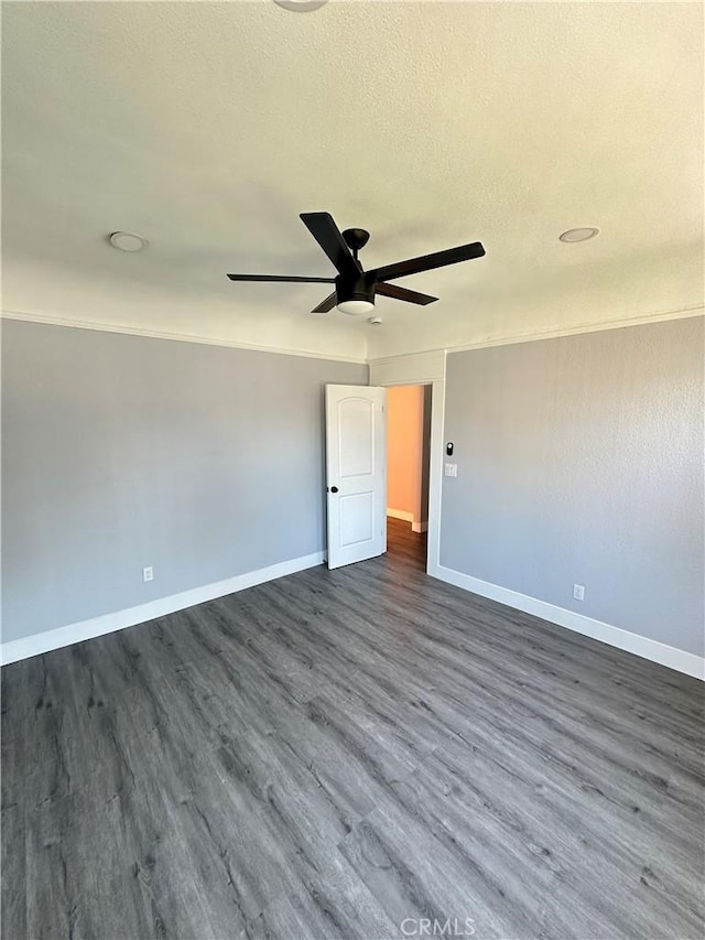 696 E 51st St E, Los Angeles, CA 90011 - spare room featuring ceiling fan and dark wood-style flooring