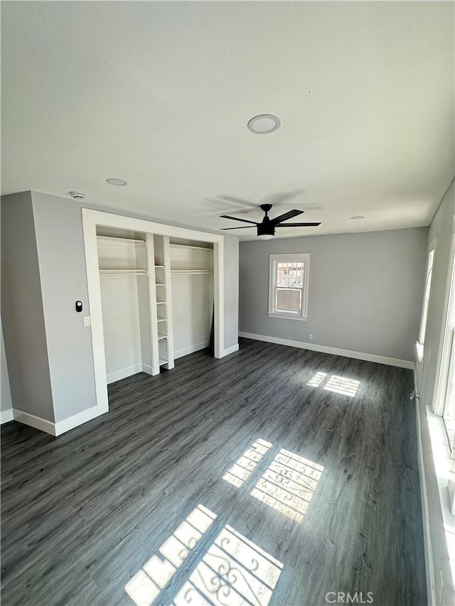 696 E 51st St E, Los Angeles, CA 90011 - unfurnished bedroom featuring dark wood-type flooring, a closet, and ceiling fan