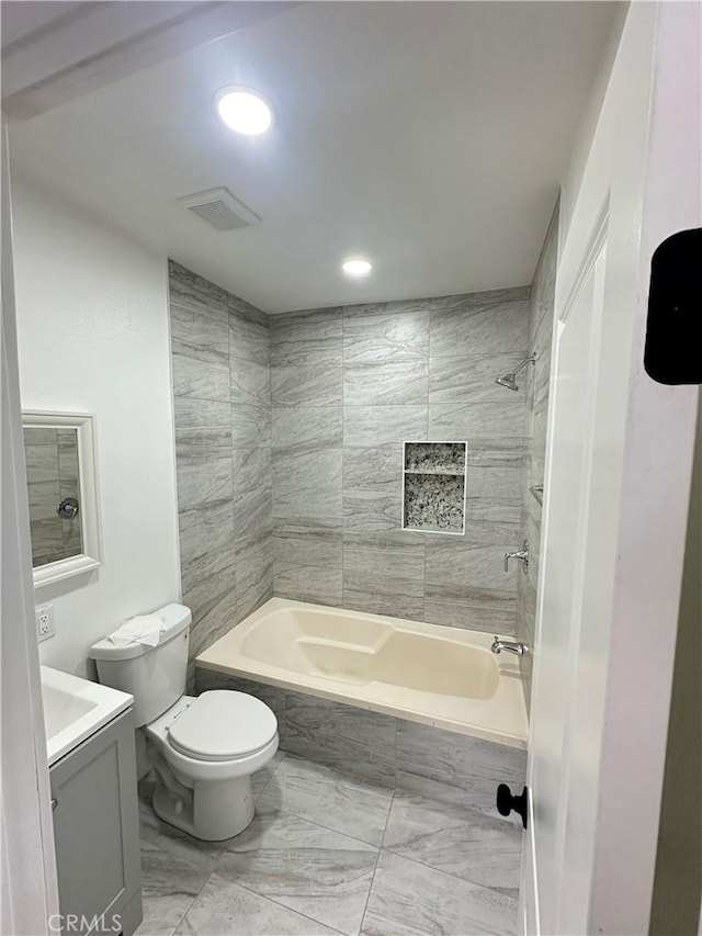 696 E 51st St E, Los Angeles, CA 90011 - full bathroom with marble look tiles, vanity, shower / bathtub combination, and recessed lighting