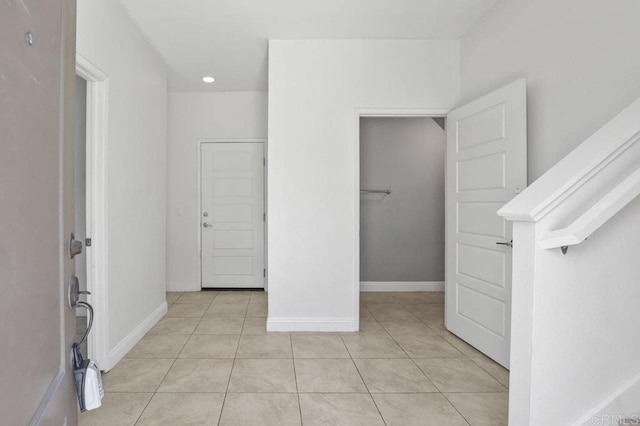5140 Calle Sand Arch Unit 61, San Diego, CA 92154 - unfurnished bedroom featuring light tile patterned floors and baseboards