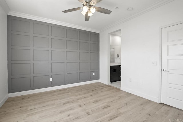5140 Calle Sand Arch Unit 61, San Diego, CA 92154 - unfurnished bedroom with a decorative wall, crown molding, light wood-style floors, ensuite bath, and a ceiling fan