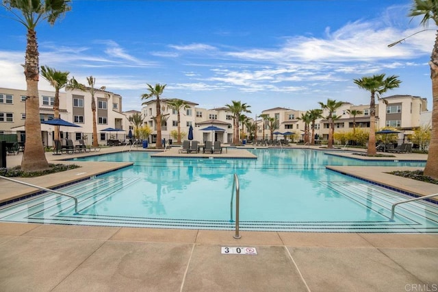 5140 Calle Sand Arch Unit 61, San Diego, CA 92154 - community pool with a residential view and a patio area