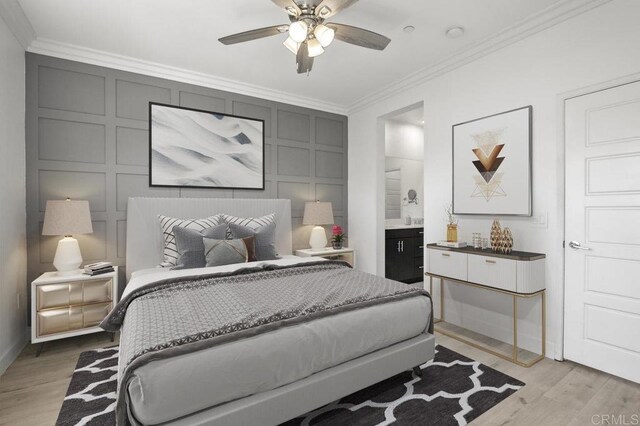5140 Calle Sand Arch Unit 61, San Diego, CA 92154 - bedroom with crown molding, light wood finished floors, a decorative wall, connected bathroom, and ceiling fan