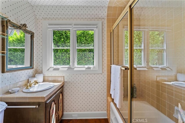 28233 N Shore Rd, Lake Arrowhead, CA 92352 - bathroom with wallpapered walls, vanity, enclosed tub / shower combo, and wood finished floors