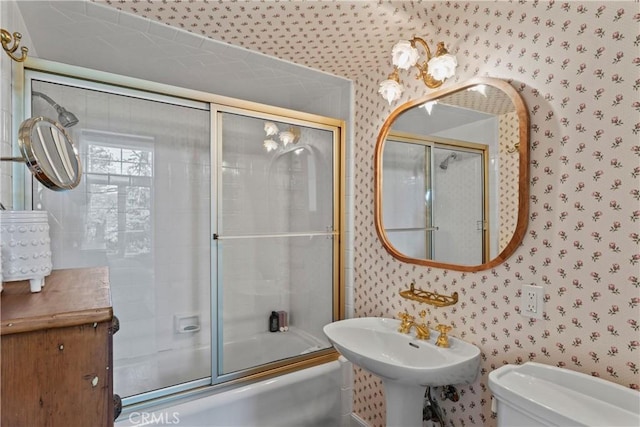 28233 N Shore Rd, Lake Arrowhead, CA 92352 - bathroom featuring wallpapered walls and shower / bath combination with glass door