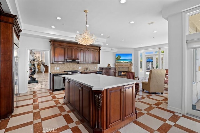 759 Foxkirk Rd, Glendale, CA 91206 - kitchen featuring inlaid floor details, appliances with stainless steel finishes, recessed lighting, under cabinet range hood, and plenty of natural light