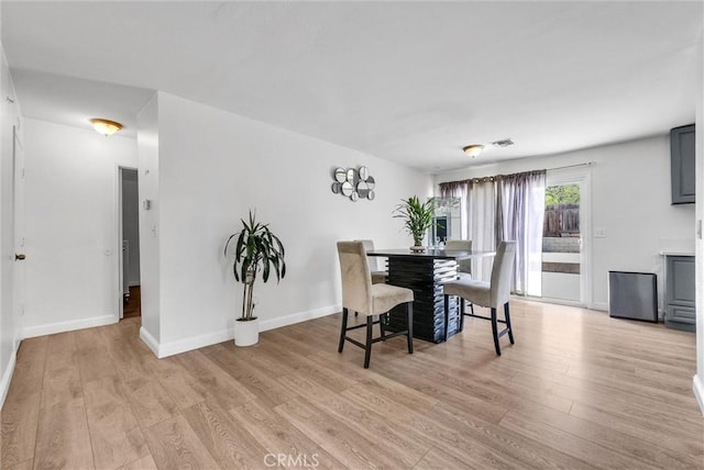 5005 Pearblossom Dr, Riverside, CA 92507 - dining area featuring light wood finished floors