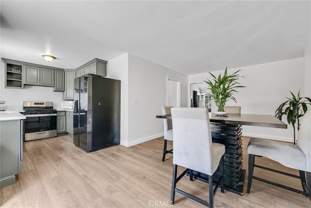 5005 Pearblossom Dr, Riverside, CA 92507 - dining area featuring light wood-style flooring and baseboards